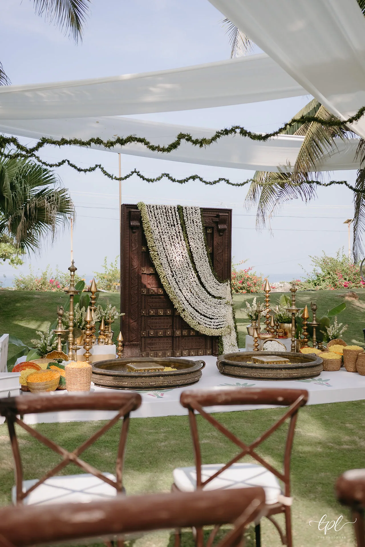 Floral wedding decor surrounded by tropical greenery